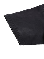 T-shirt sleeve close-up in black cotton with a double-stitched hem