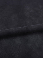 T-shirt fabric close-up in dark indigo with a visible seam along the hem