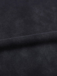 T-shirt fabric close-up in dark indigo with a visible seam along the hem