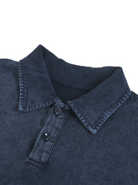 Close-up of a navy blue heavyweight washed polo shirt with button placket