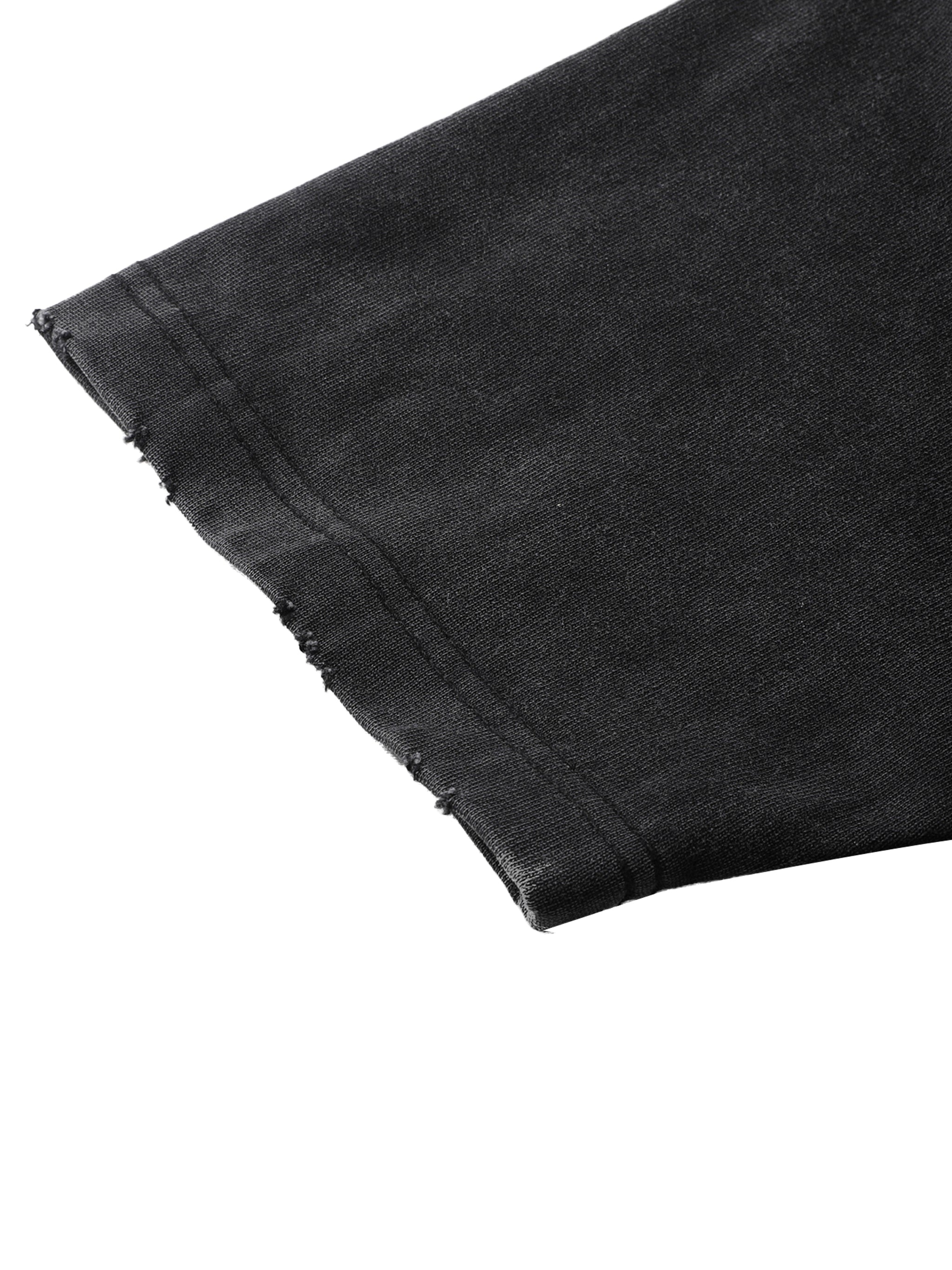 Close-up of black heavyweight streetwear t-shirt sleeve with raw edge hem detail
