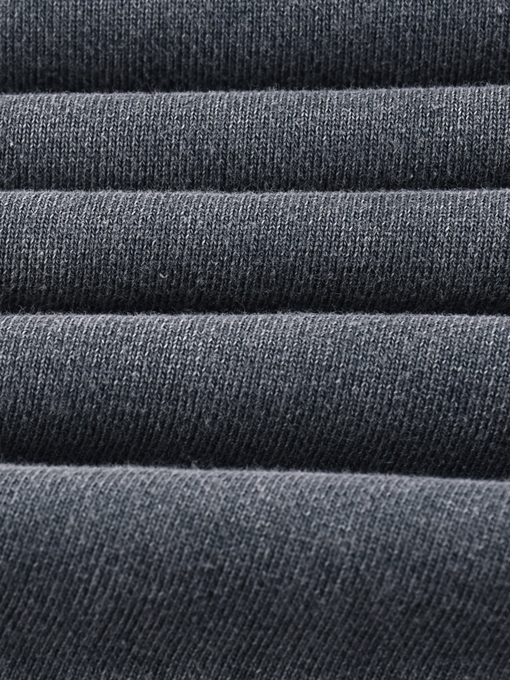 Close-up of heavyweight dark grey knit fabric with visible textured weave