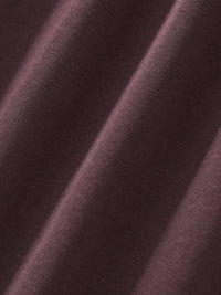 Close-up of heavyweight dark brown streetwear fabric with soft textured weave
