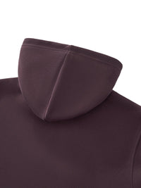 Close-up of a heavyweight, dark plum streetwear hoodie with soft fabric texture