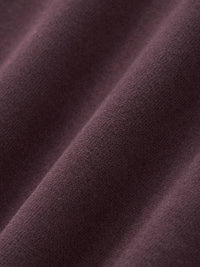 Close-up of heavyweight, textured brown streetwear fabric with soft, premium finish