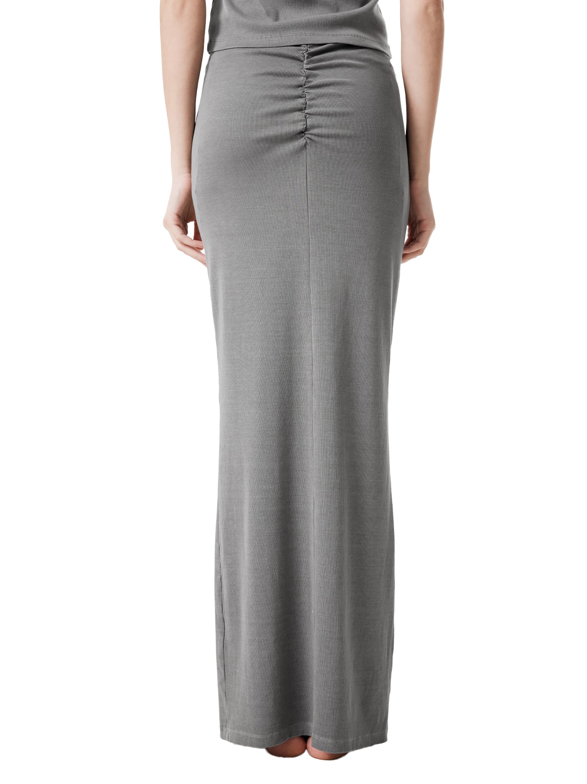 Back view of woman wearing a high-waisted, ruched grey maxi skirt
