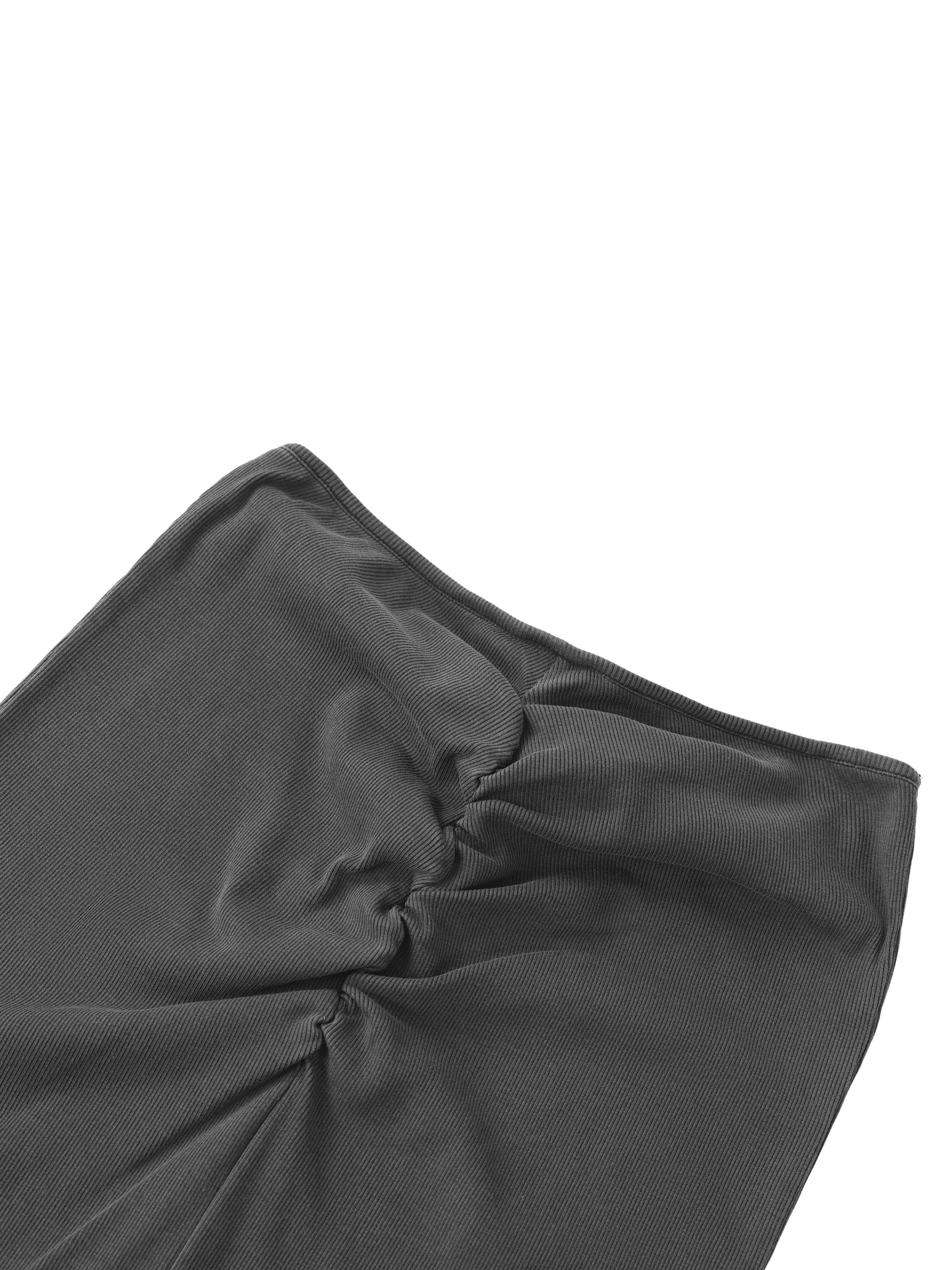Close-up of black ribbed streetwear fabric with ruched seam detail