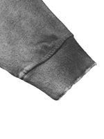 Zippered hoodie sleeve in grey fleece with ribbed cuff and sun-fade, raw-edge look.