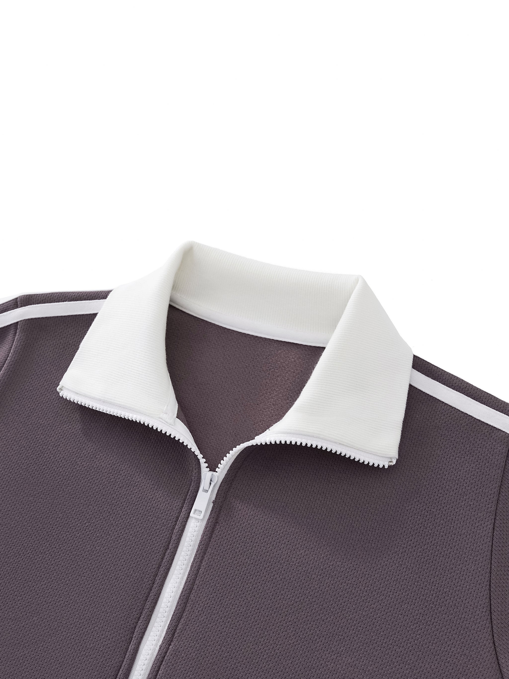 Close-up of a textured zip-up jacket with white collar and stripe detail