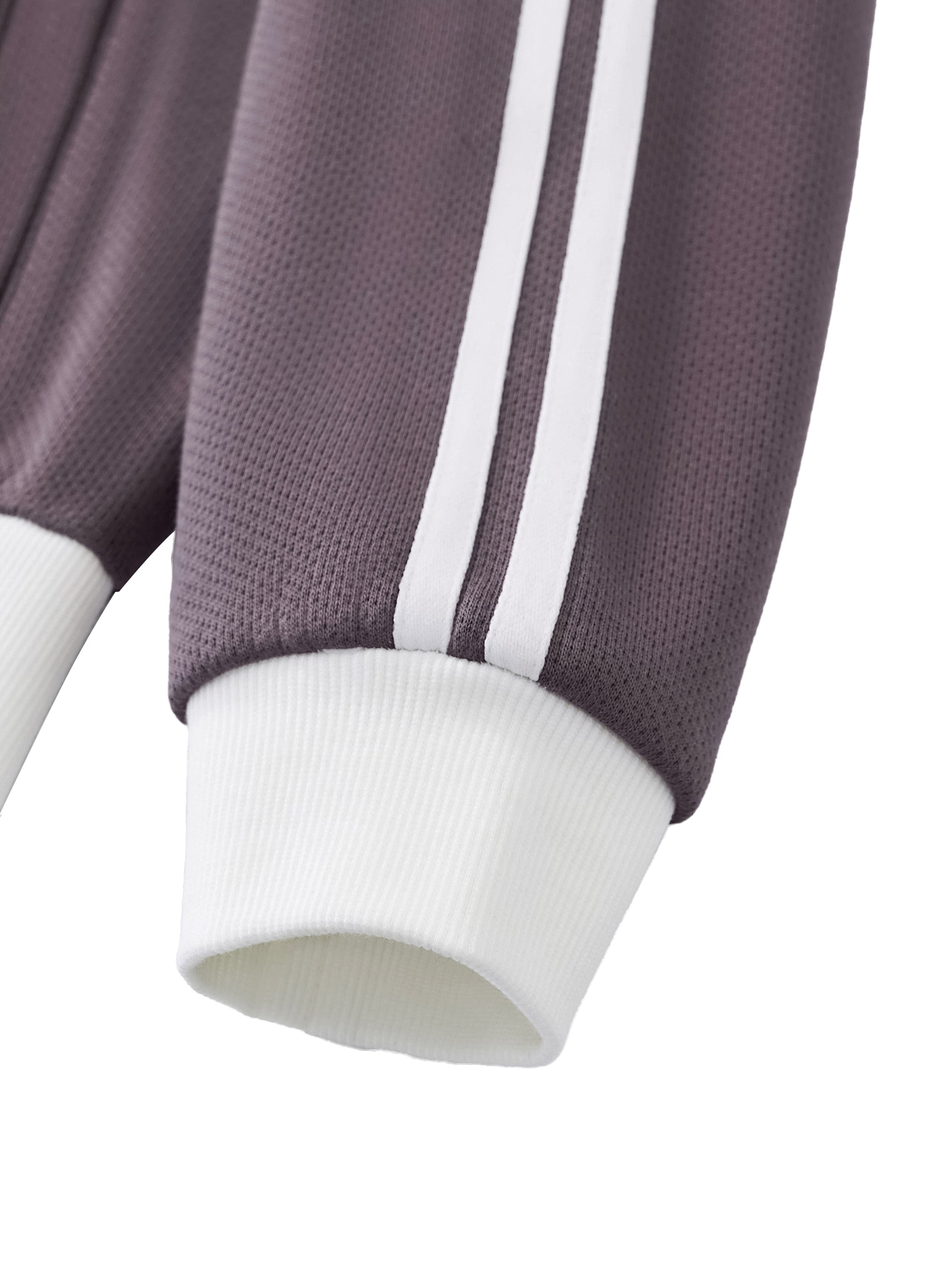 Close-up of a heavyweight streetwear sleeve with white ribbed cuff and double stripe design