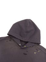 Distressed black hooded sweatshirt with paint splatter and raw edge details