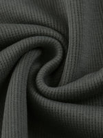 Wolvyn Apparel mineral-wash waffle knit T-shirt fabric in dark gray with ribbed texture