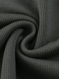 Wolvyn Apparel mineral-wash waffle knit T-shirt fabric in dark gray with ribbed texture