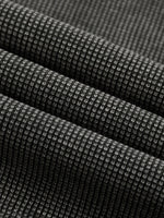 Wolvyn Apparel ODMPOD mineral wash waffle knit T-shirt fabric close-up in charcoal gray