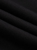 Wolvyn Apparel shorts, black mineral-wash waffle-knit fabric close-up