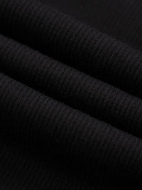Wolvyn Apparel shorts, black mineral-wash waffle-knit fabric close-up