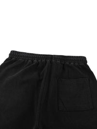 Wolvyn Apparel mineral wash waffle-knit shorts in black with elastic waistband and back pocket