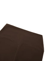 Leggings, brown ODMPOD Standard Issue high-waisted yoga leggings; close-up seam detail (flat lay).