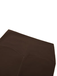 Leggings, brown ODMPOD Standard Issue high-waisted yoga leggings; close-up seam detail (flat lay).