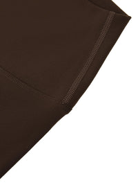 Wolvyn Apparel Standard Issue high-waisted yoga leggings in chocolate brown; close-up of side seam and stitched hem.