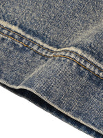 Denim shorts by ODMPOD in blue vintage-wash with orange topstitching