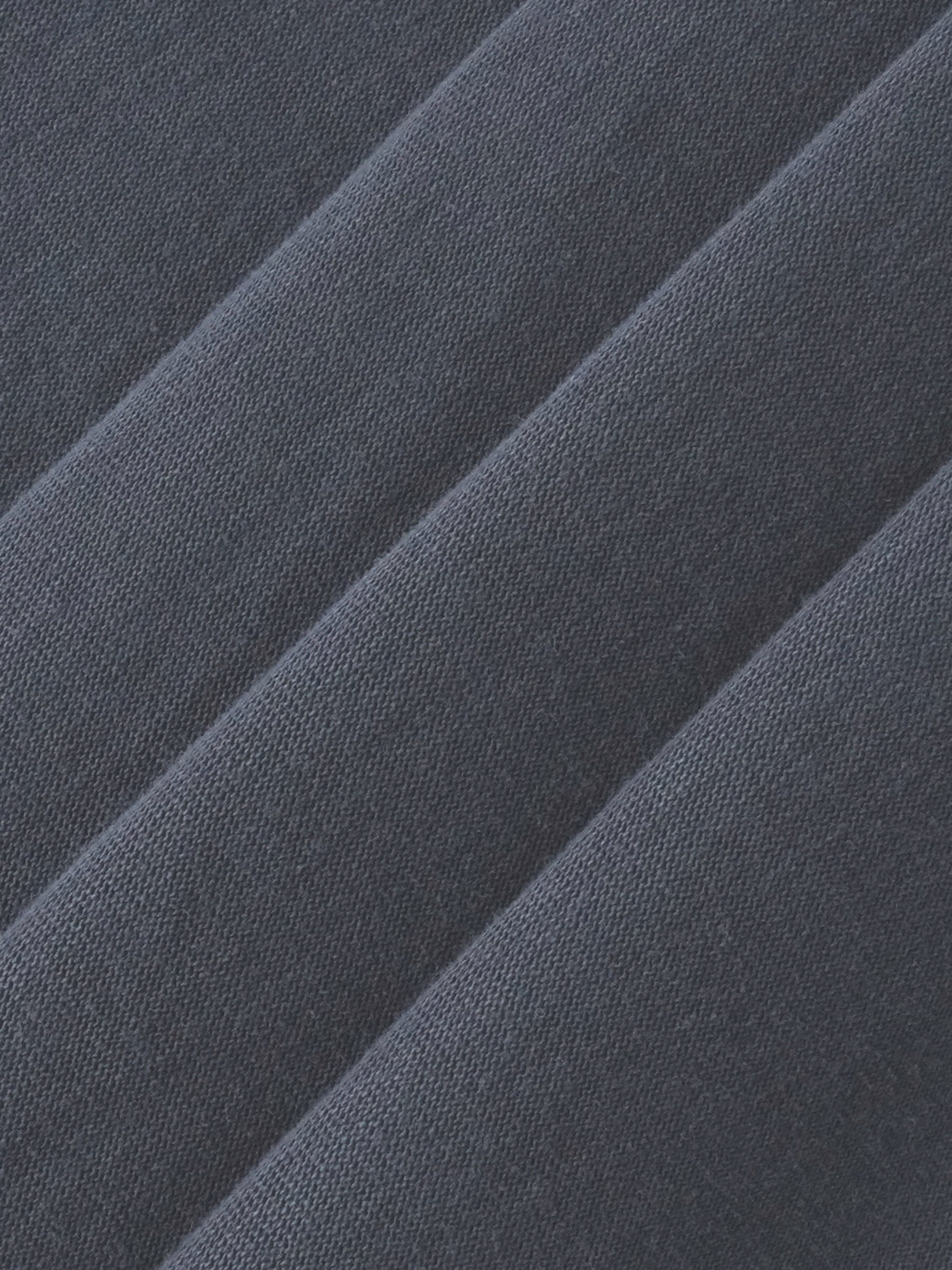 Heavyweight navy blue streetwear fabric with textured diagonal folds