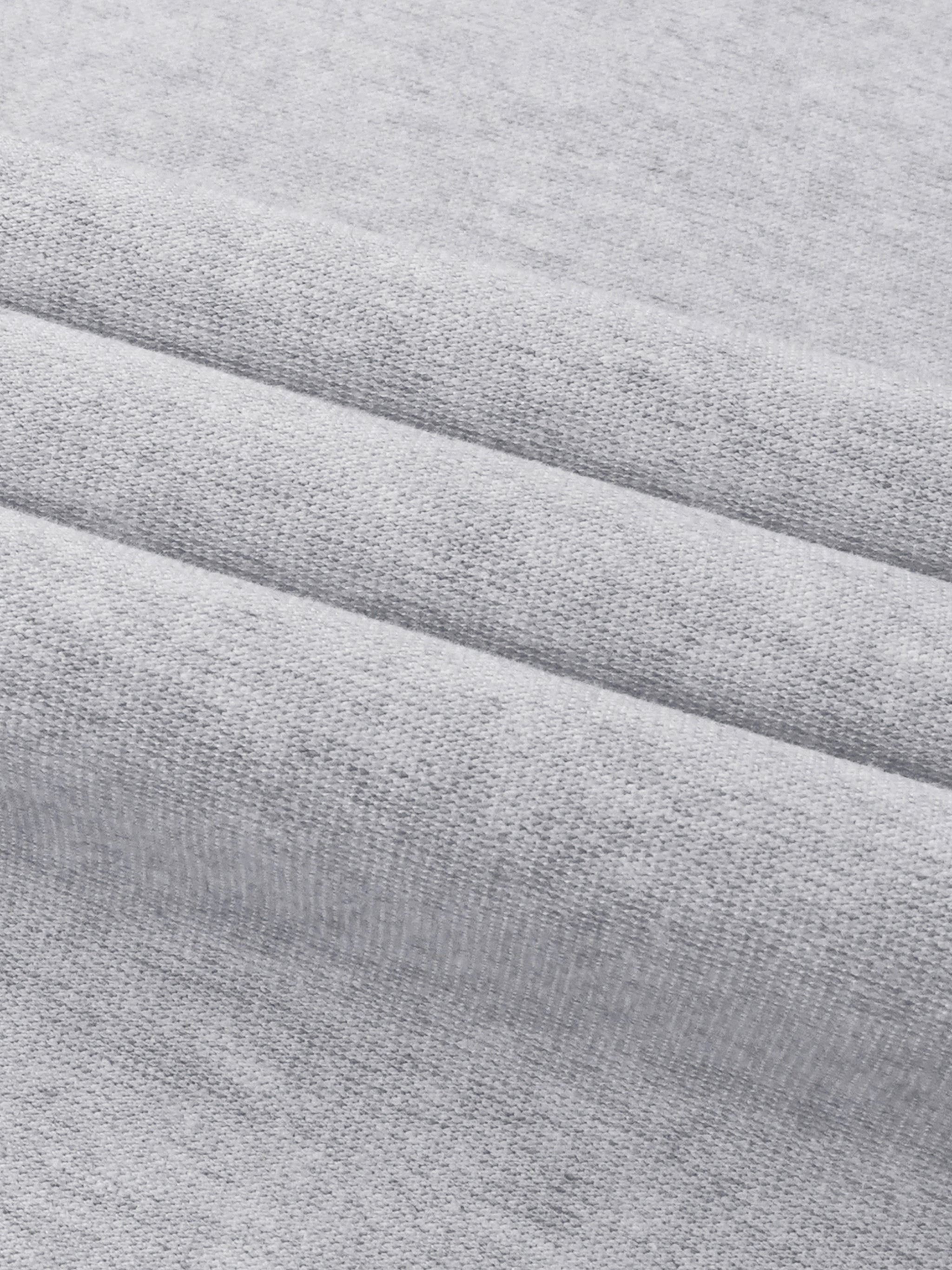 Close-up of premium heavyweight grey streetwear fabric with soft texture