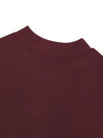 Wolvyn romper bodysuit neckline close-up in burgundy fabric