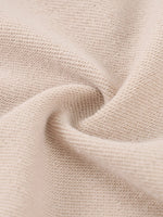 Hoodie fabric close-up in beige, showcasing a soft, textured knit