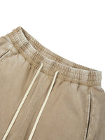 Pants: Villain Disruptor unisex mineral-wash barrel-leg pants in beige with cream drawstrings