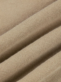 Pants fabric close-up in beige knit texture by ODMPOD