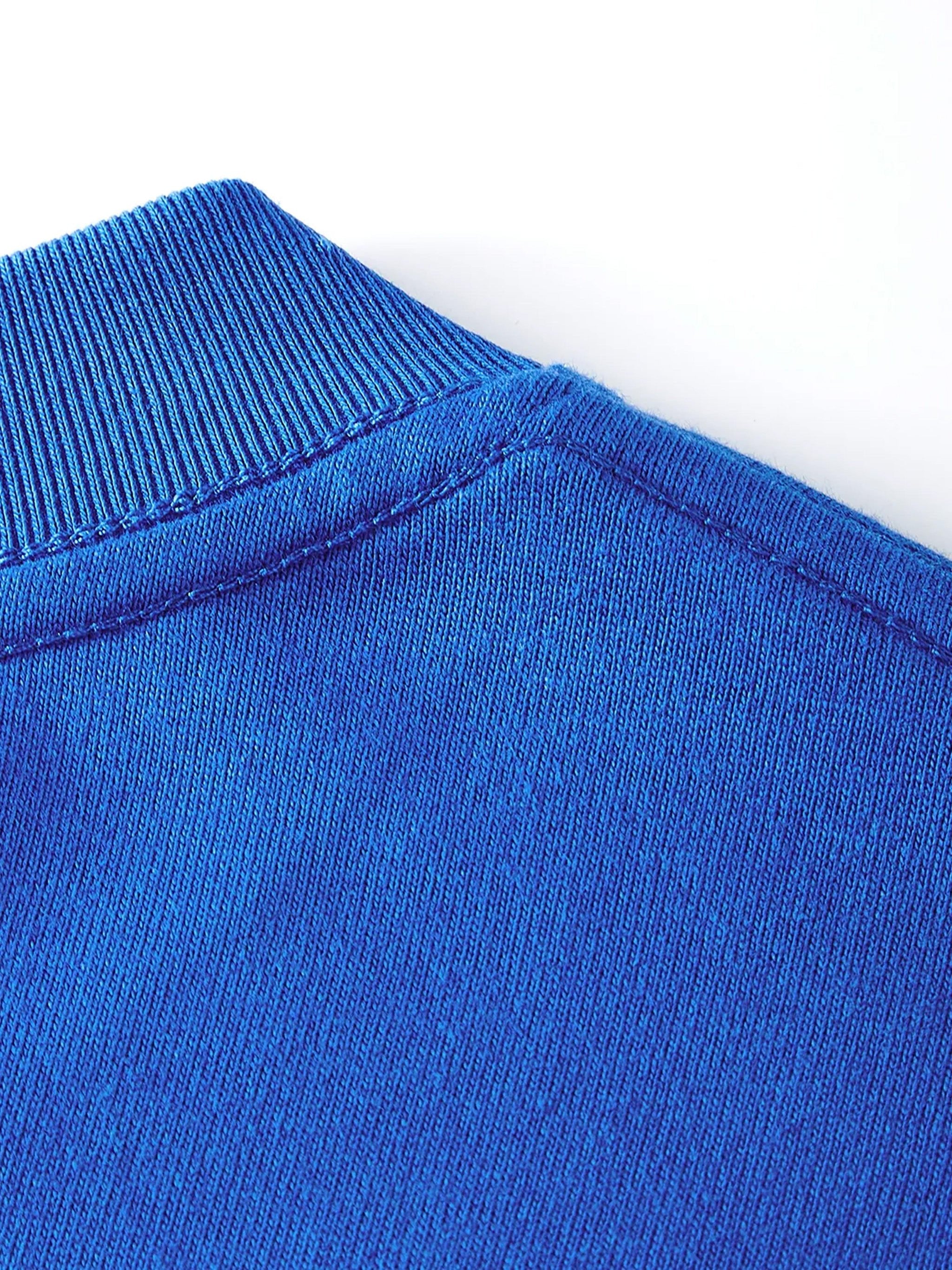 Close-up of blue cotton kids T-shirt collar showcasing ribbed neck and stitching detail