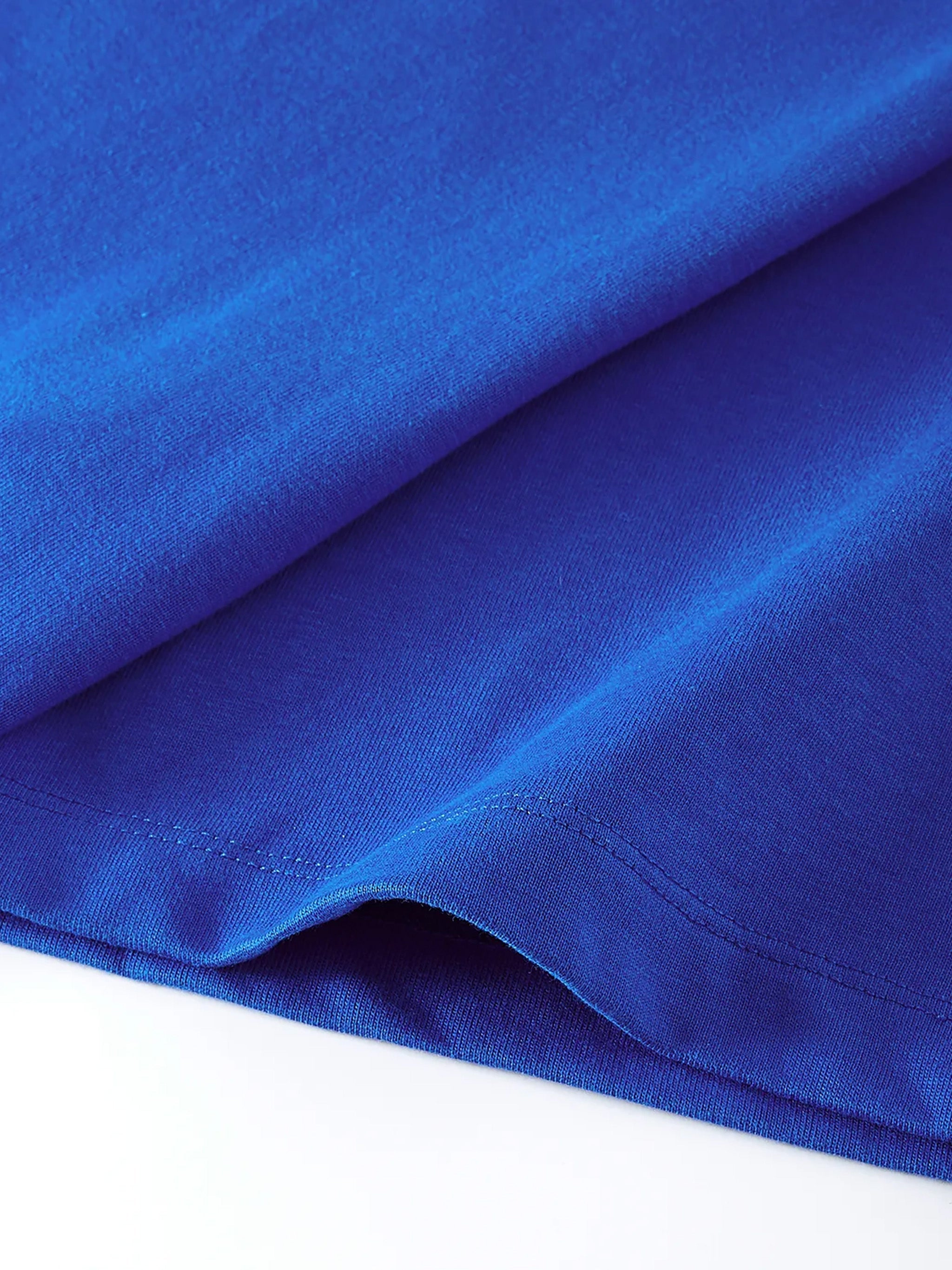Close-up of blue cotton kids t-shirt fabric with visible stitching detail