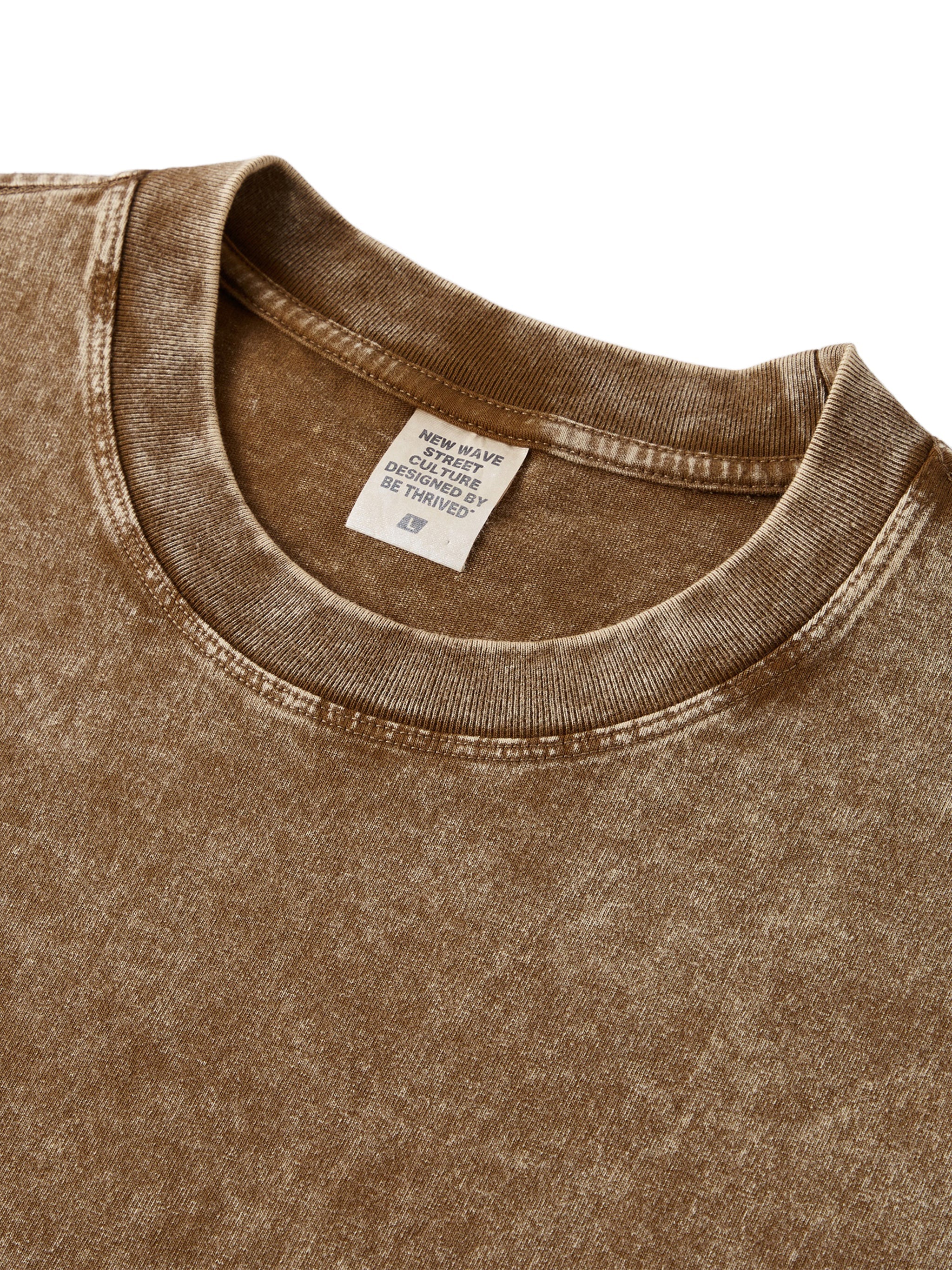 Brown snow-washed kids t-shirt with crew neck, heavyweight fabric, close-up view.