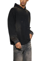 Black sun-faded frayed fleece hoodie with distressed details, worn by male model