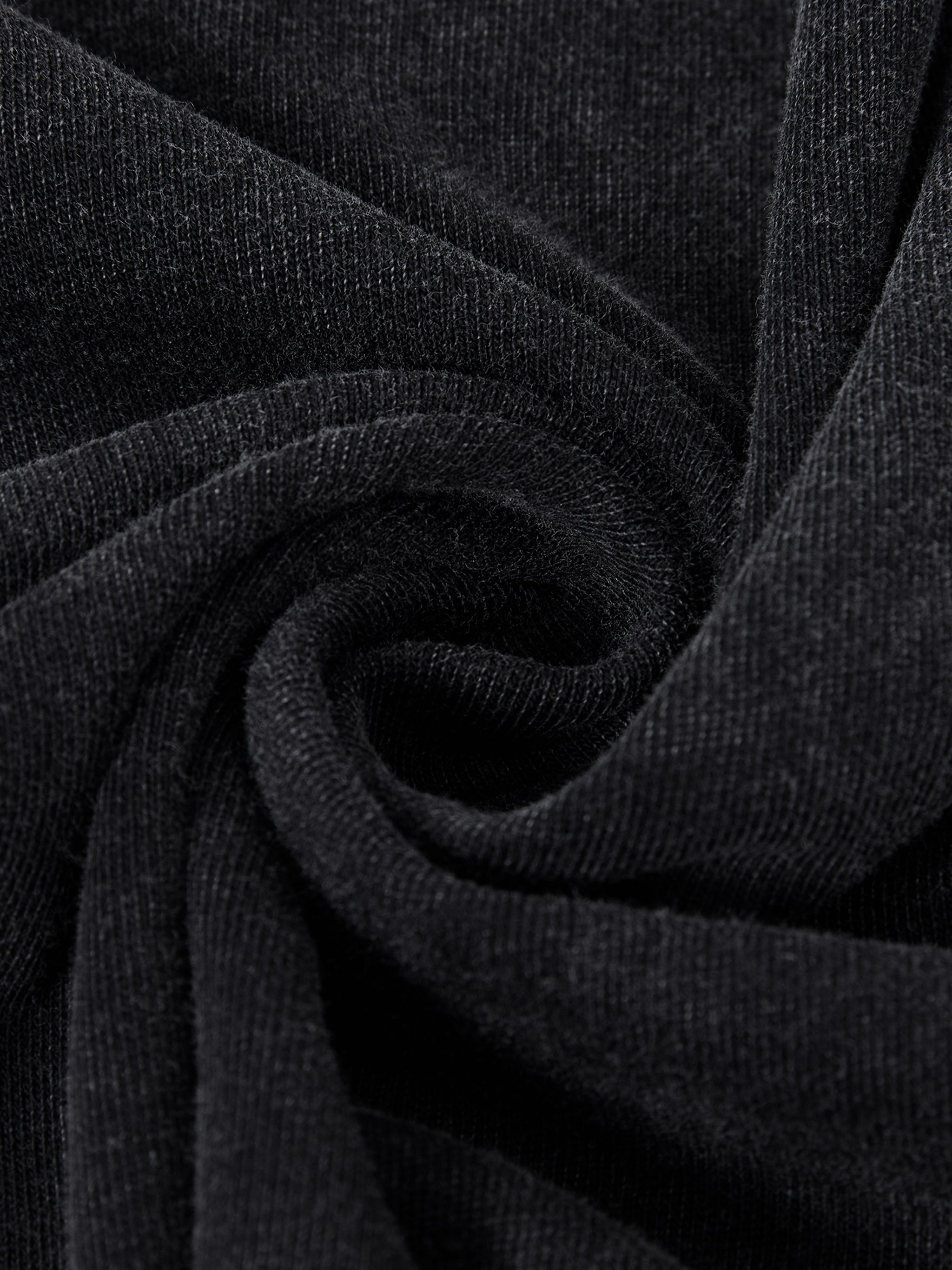 Close-up of black vintage wash heavyweight cotton fabric with subtle textured weave.