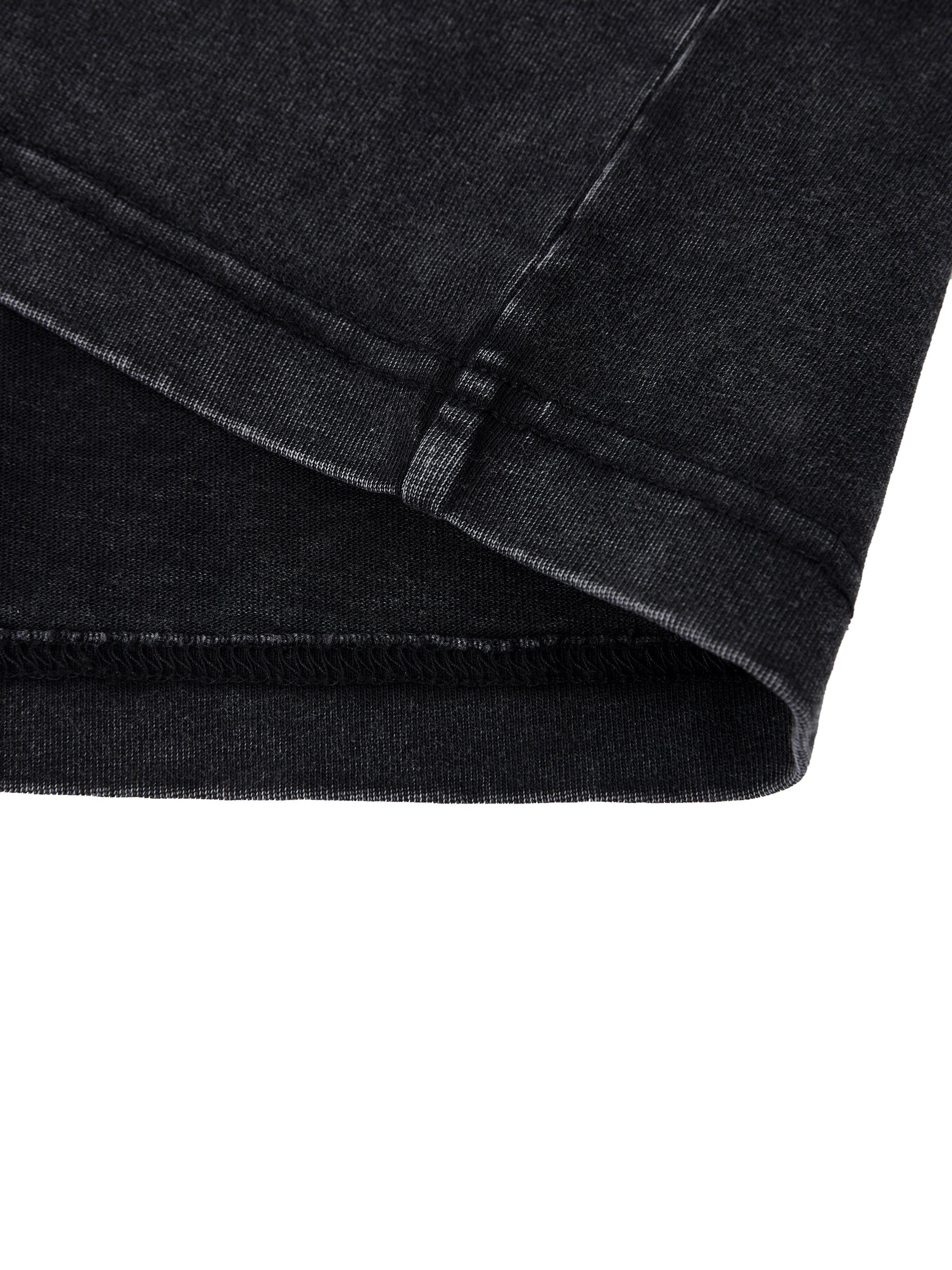 Close-up of black vintage wash heavyweight t-shirt sleeve with visible stitching details