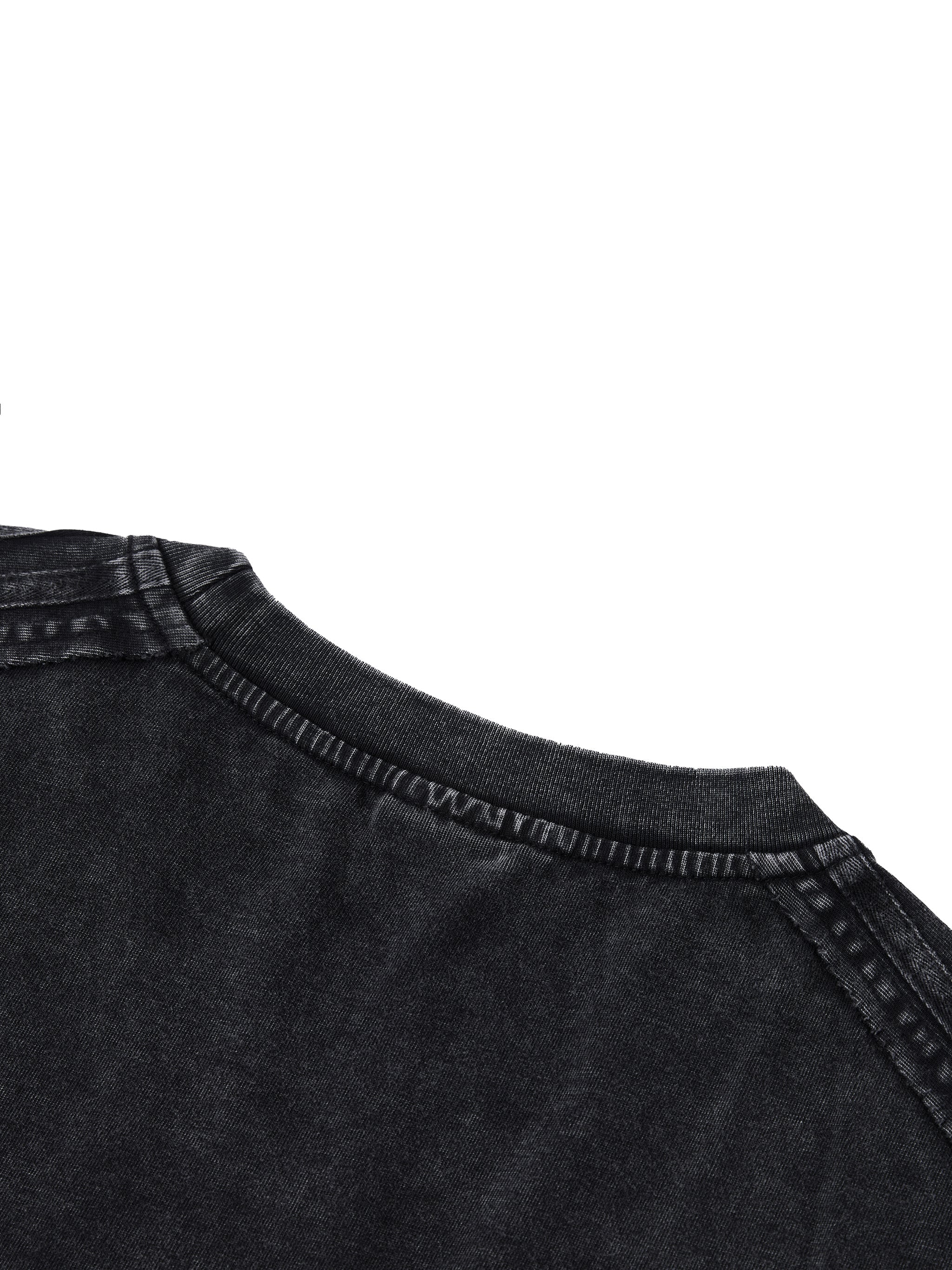 Close-up of black vintage wash boxy t-shirt with heavyweight fabric and visible stitching