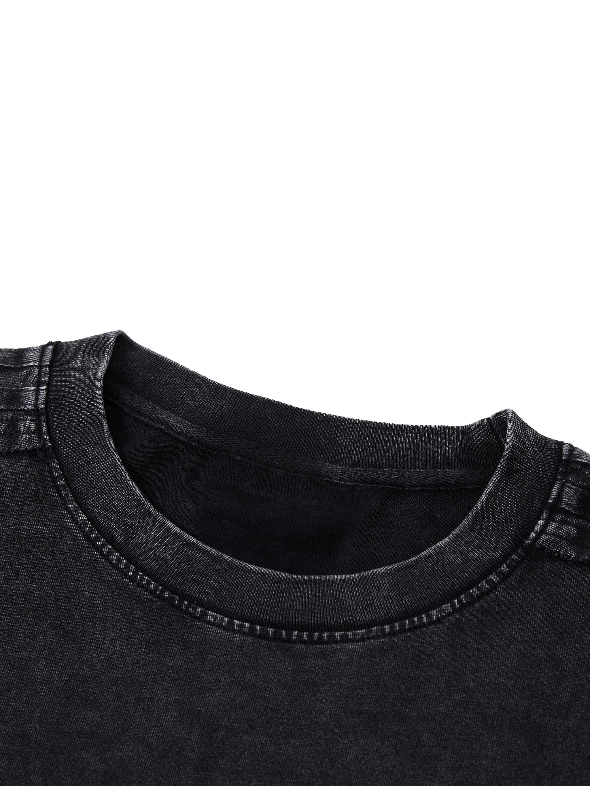 Close-up of a unisex vintage wash black boxy t-shirt neckline and stitching detail