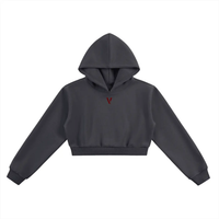 Black cropped hoodie with long sleeves and minimalist red 'V' logo on chest
