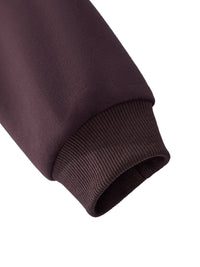 Close-up of brown heavyweight streetwear hoodie sleeve and ribbed cuff