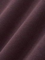 Close-up of heavyweight purple streetwear fabric with soft texture and visible weave