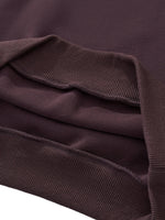 Close-up of heavyweight cropped hoodie hem in dark purple with ribbed trim