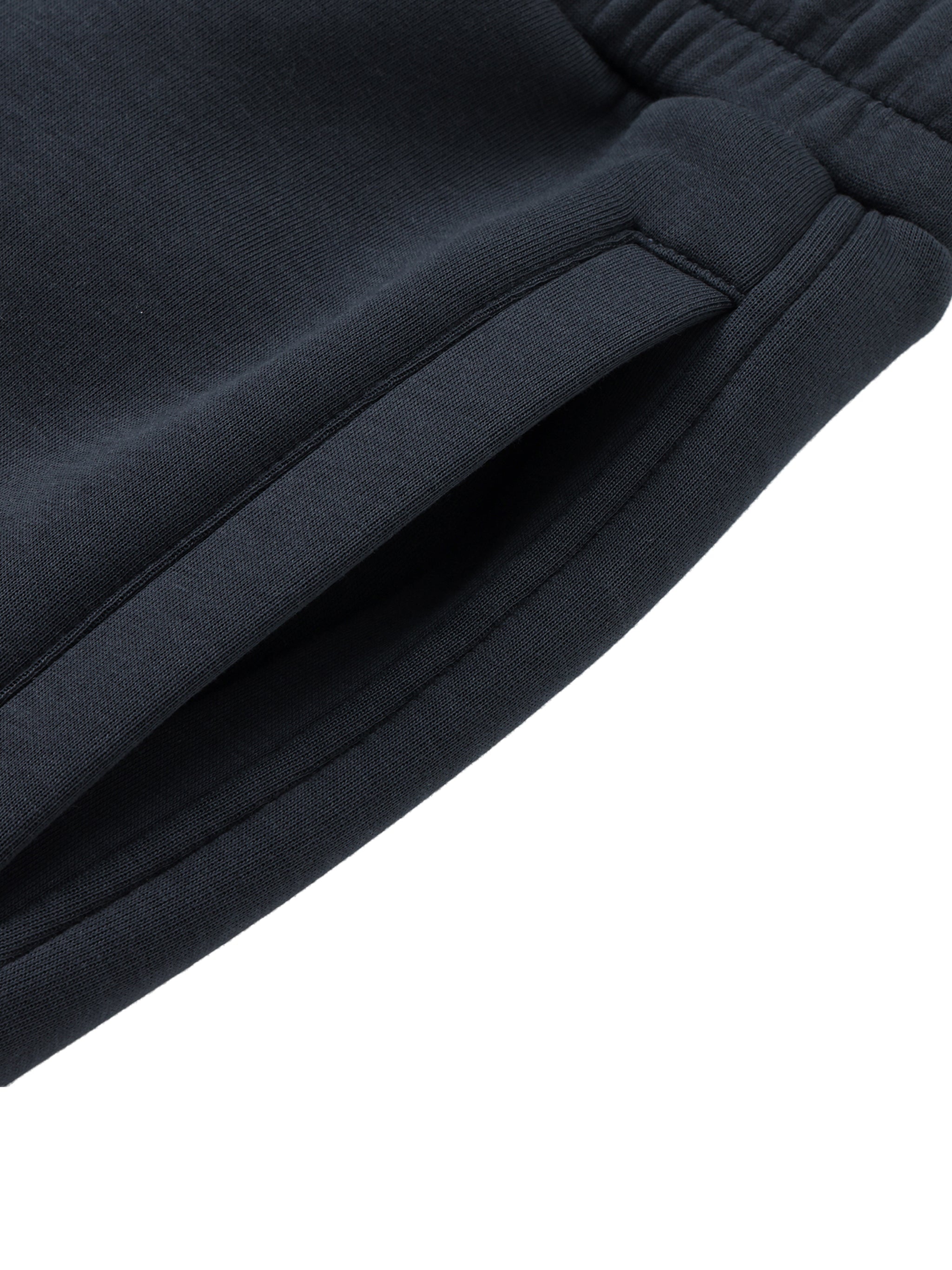 Close-up of black heavyweight jogger sweatpants pocket and waistband details