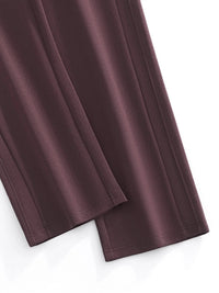 Close-up of straight leg, dark brown sweatpants with seam details on white background.