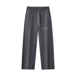 Dark grey straight leg sweatpants with drawstring, pocket details, and 'VILLAIN' text print