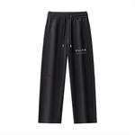 Black straight leg sweatpants with drawstring waist, 'VILLAIN' logo and red accent