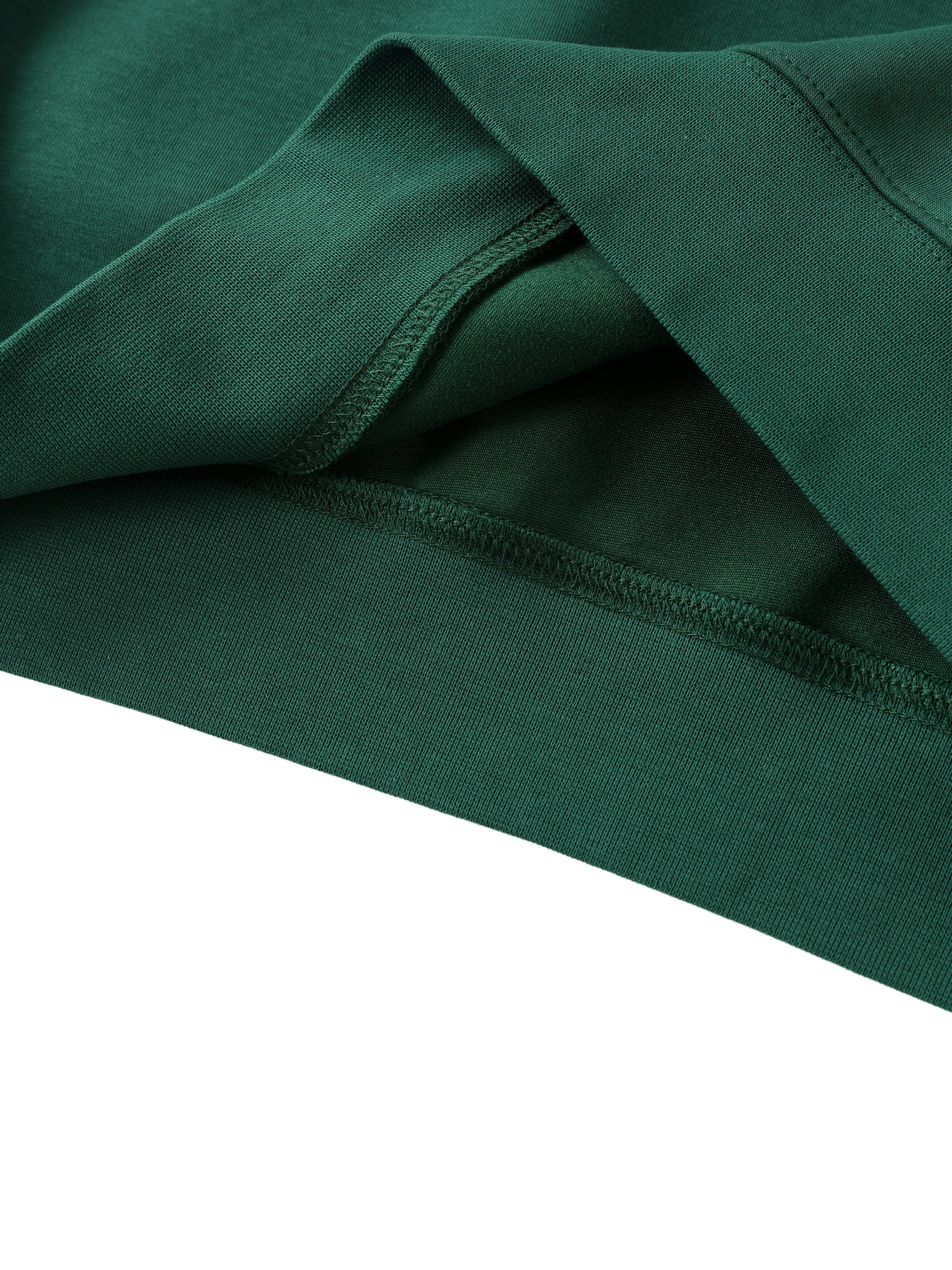 Close-up of green heavyweight crewneck sweatshirt fabric and stitching detail