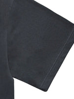Close-up of black heavyweight knitted T-shirt sleeve with visible stitching detail