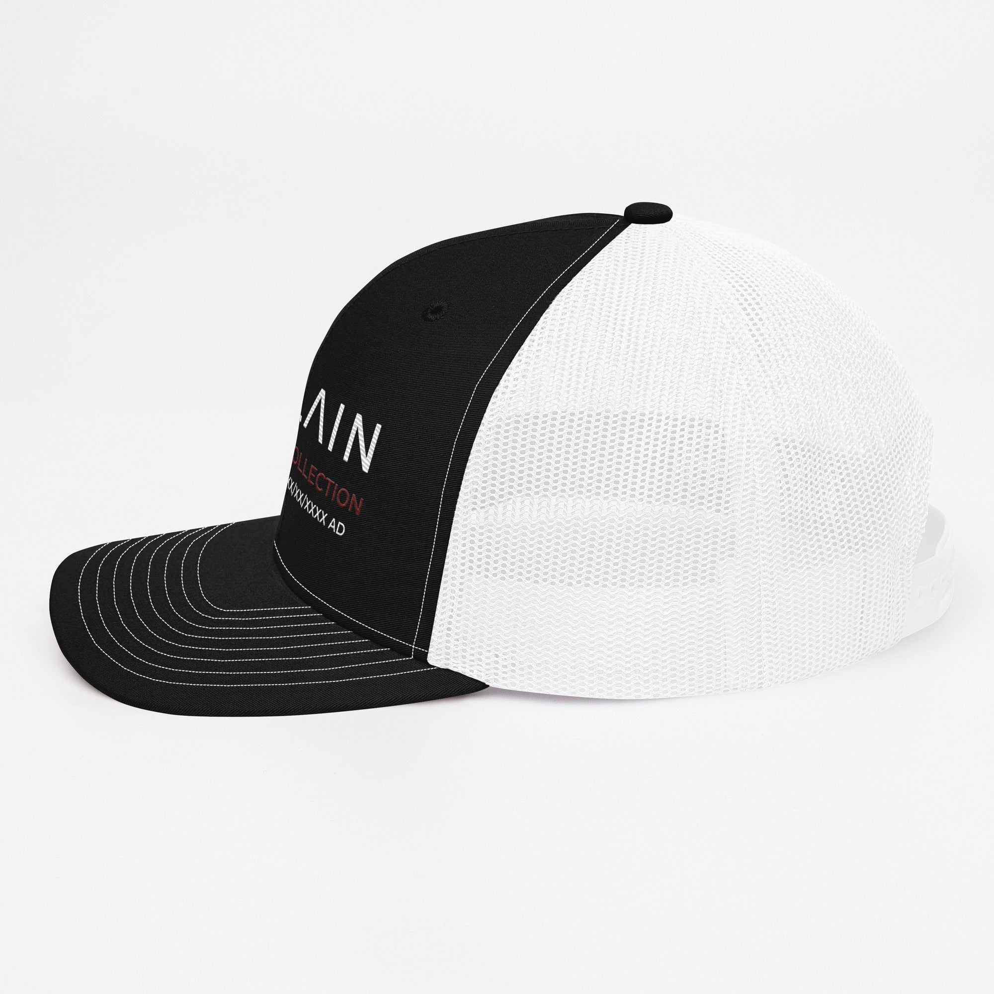 Black and white mesh trucker cap with embroidered text, side view on white background